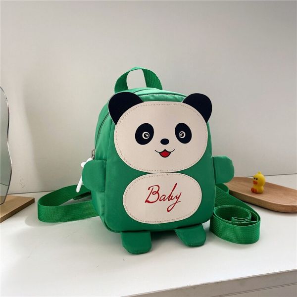 Petit Sac À Dos D'Écolier Panda Vert Avec Un Fond Une Table Blanche
