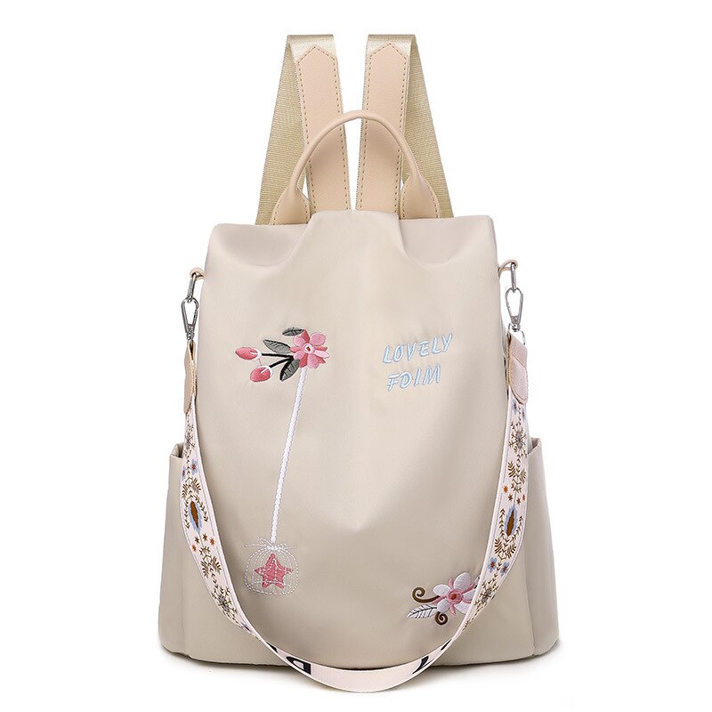Blumenbestickter Rucksack für Frauen in Beige mit weißem Hintergrund